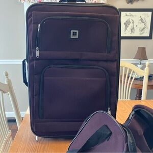 Leisure 2 Piece Plum  Suitcase with matching Duffle wheels and pull up handle